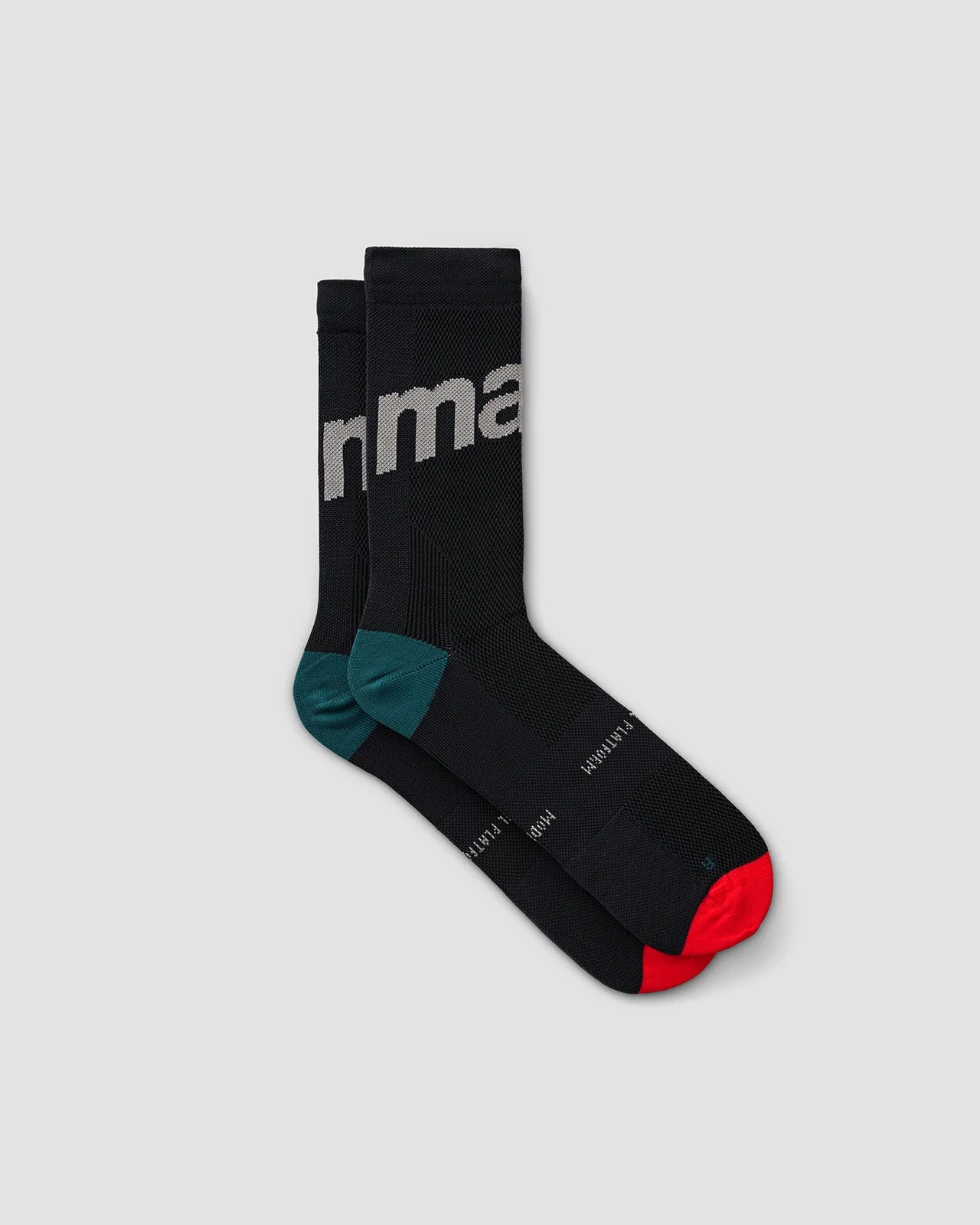 A pair of MAAP training socks for road cycling and bicycle racing in black with red toe cap and teal heel