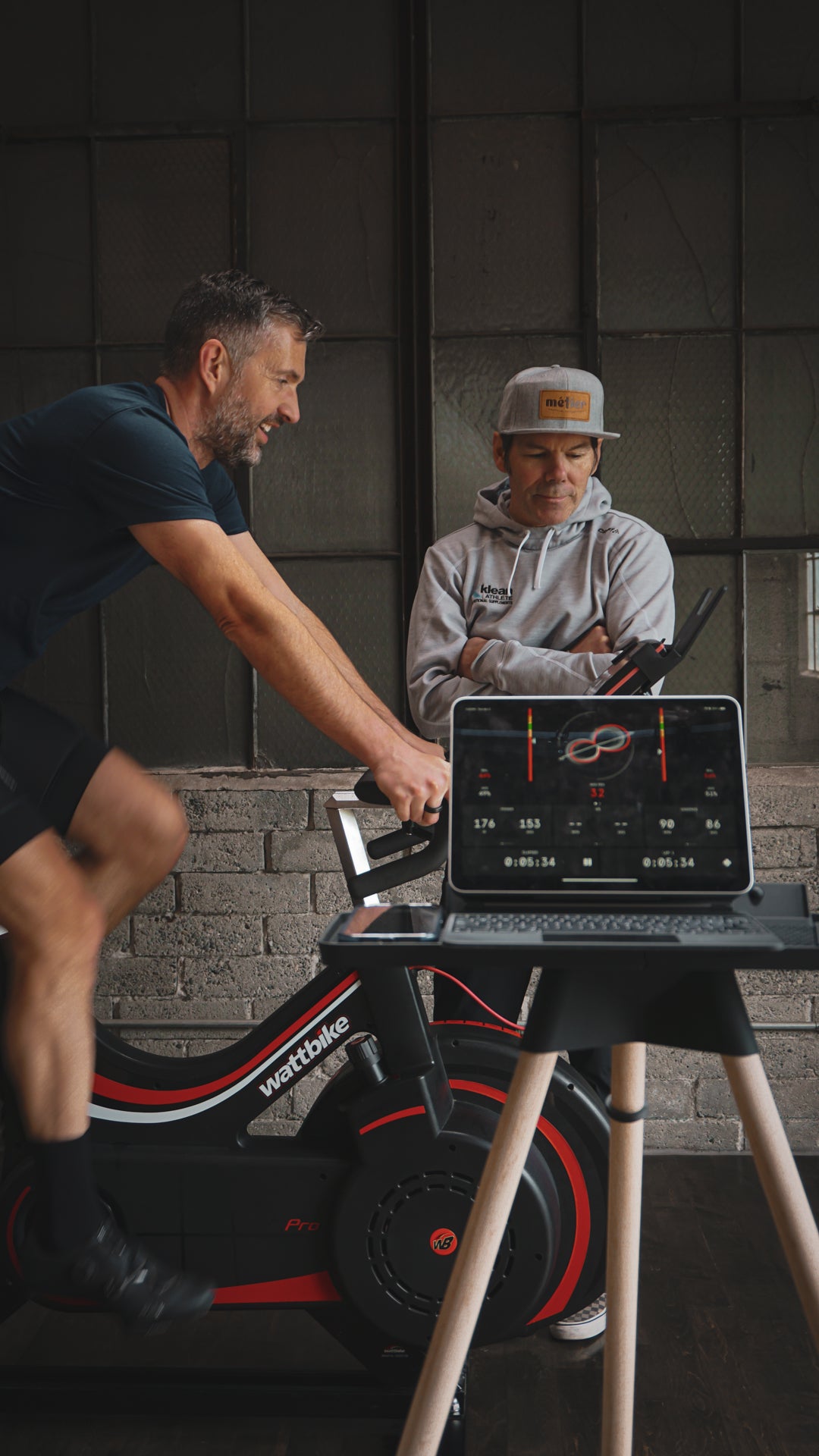 A road cyclist completes an INSCYD metabolic test with a professional cycling coach in the training studio at Metier Cycling & Cafe