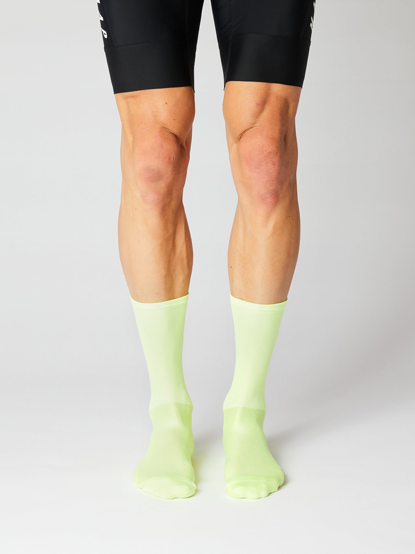 A pair of Fingerscrossed socks in Neon Green viewed from the front