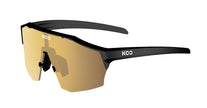 A pair of KOO Alibi sunglasses in black matt with gold mirror lens