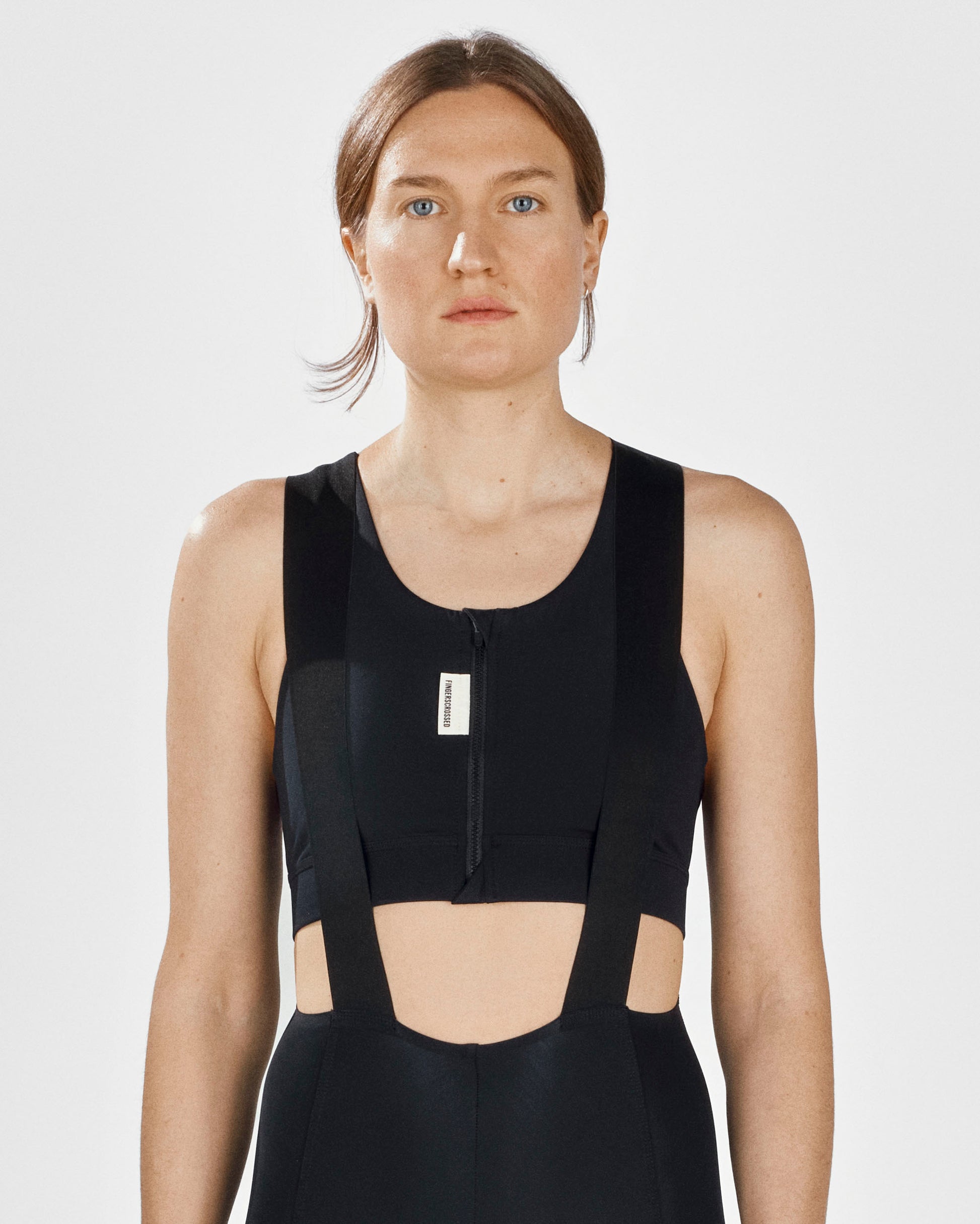 A close up of the front of a Fingerscrossed #Road cycling women's bra in black