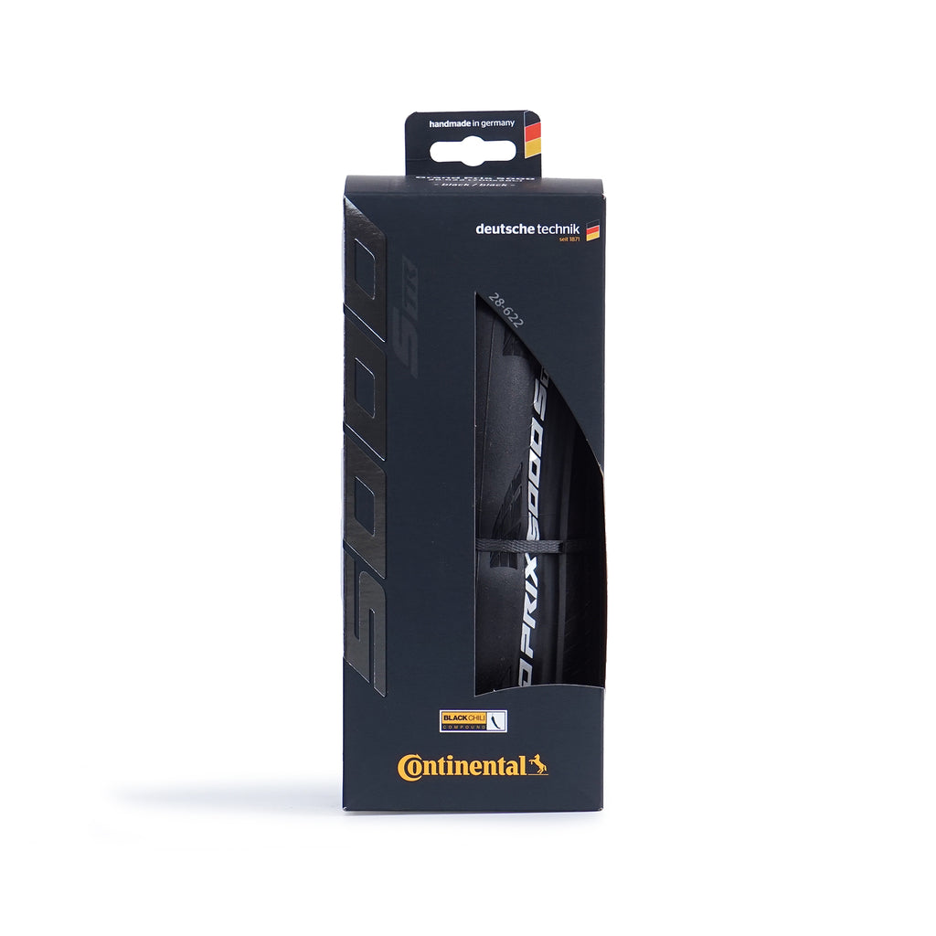 The front of a Continental GP5000 S TR road bicycle racing tire in a black box