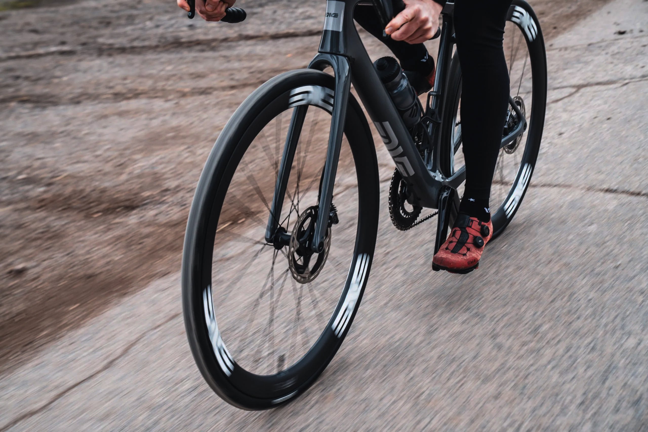 A close up of the Enve AR40 on an Enve Fray riding down a road
