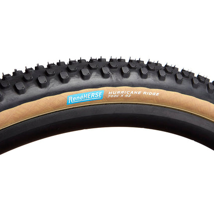A Rene Herse Hurricane Ridge Gravel bike tire for off road riding with tan side walls