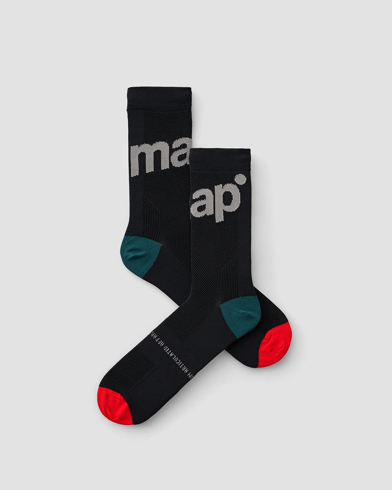 Two MAAP training socks for road cycling and bicycle racing in black with red toe cap and teal heel