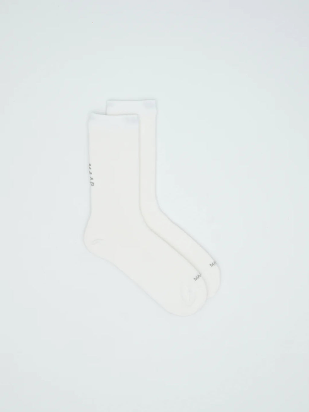 A pair of MAAP Team Socks in white on a white background