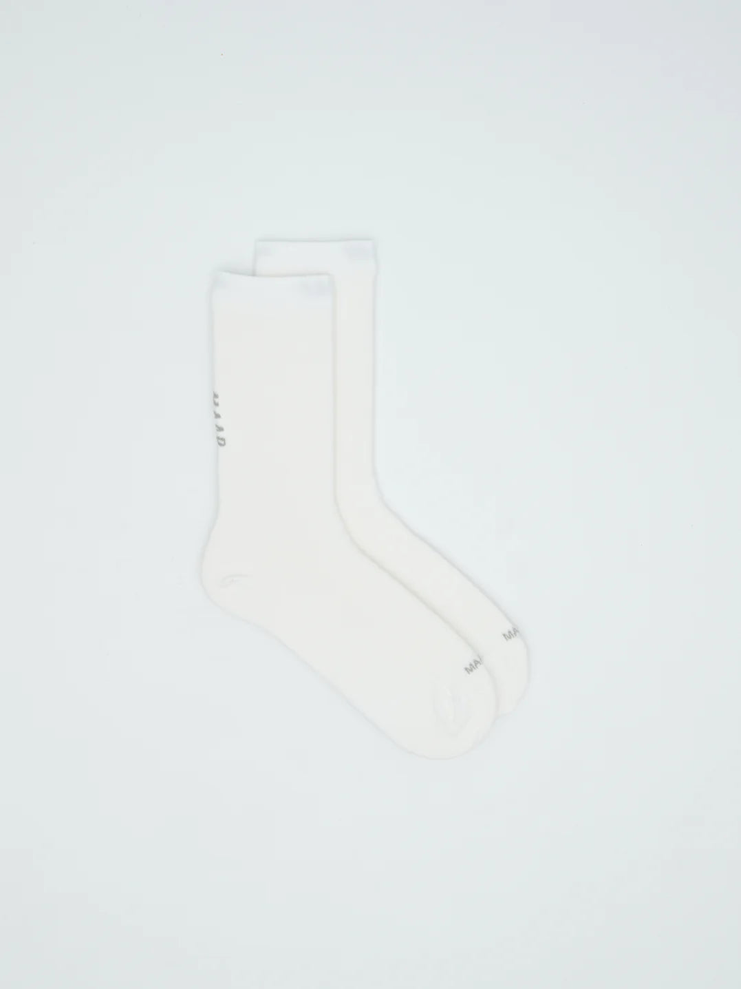 A pair of MAAP Team Socks in white on a white background