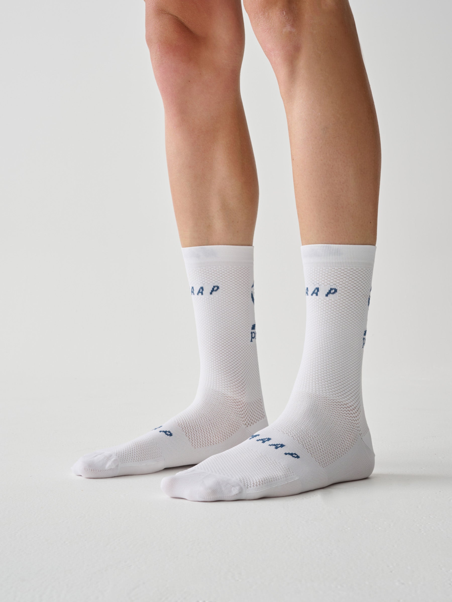 A close up of the front of a pair of MAAP Aether Socks in White