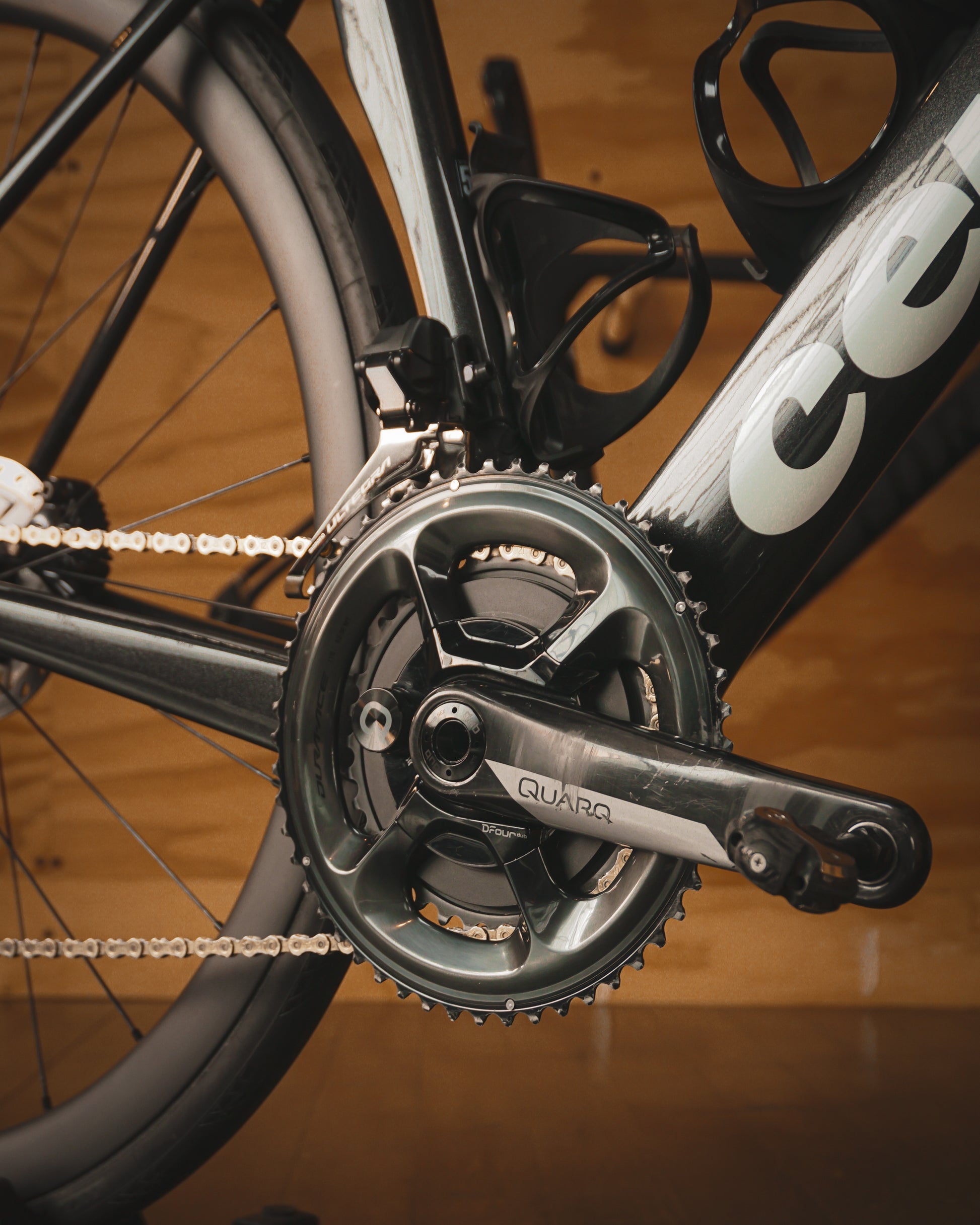 A close up of the Quarq power crankset with Shimano chainrings on a Cervelo Soloist Road Rental bike at Metier Cycling and Cafe