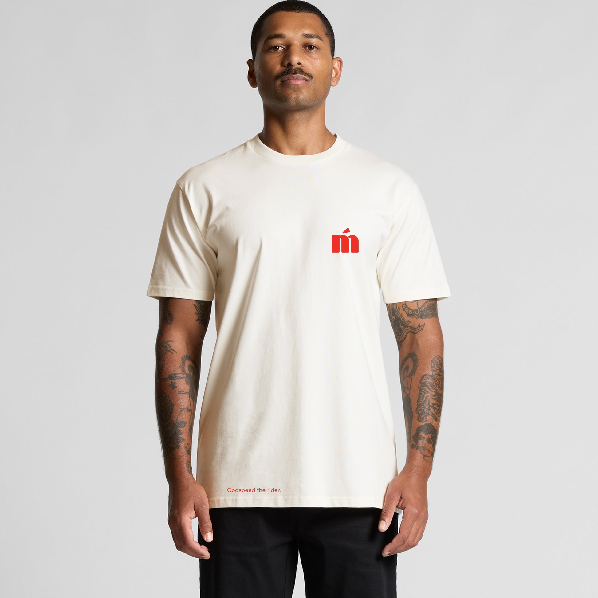 A man wearing a Métier Icon Tee in crème, front view