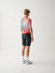 A male cyclist wearing a MAAP Men's Blurred Out 2.0 Pro Hex Short Sleeve Jersey in Red Mix