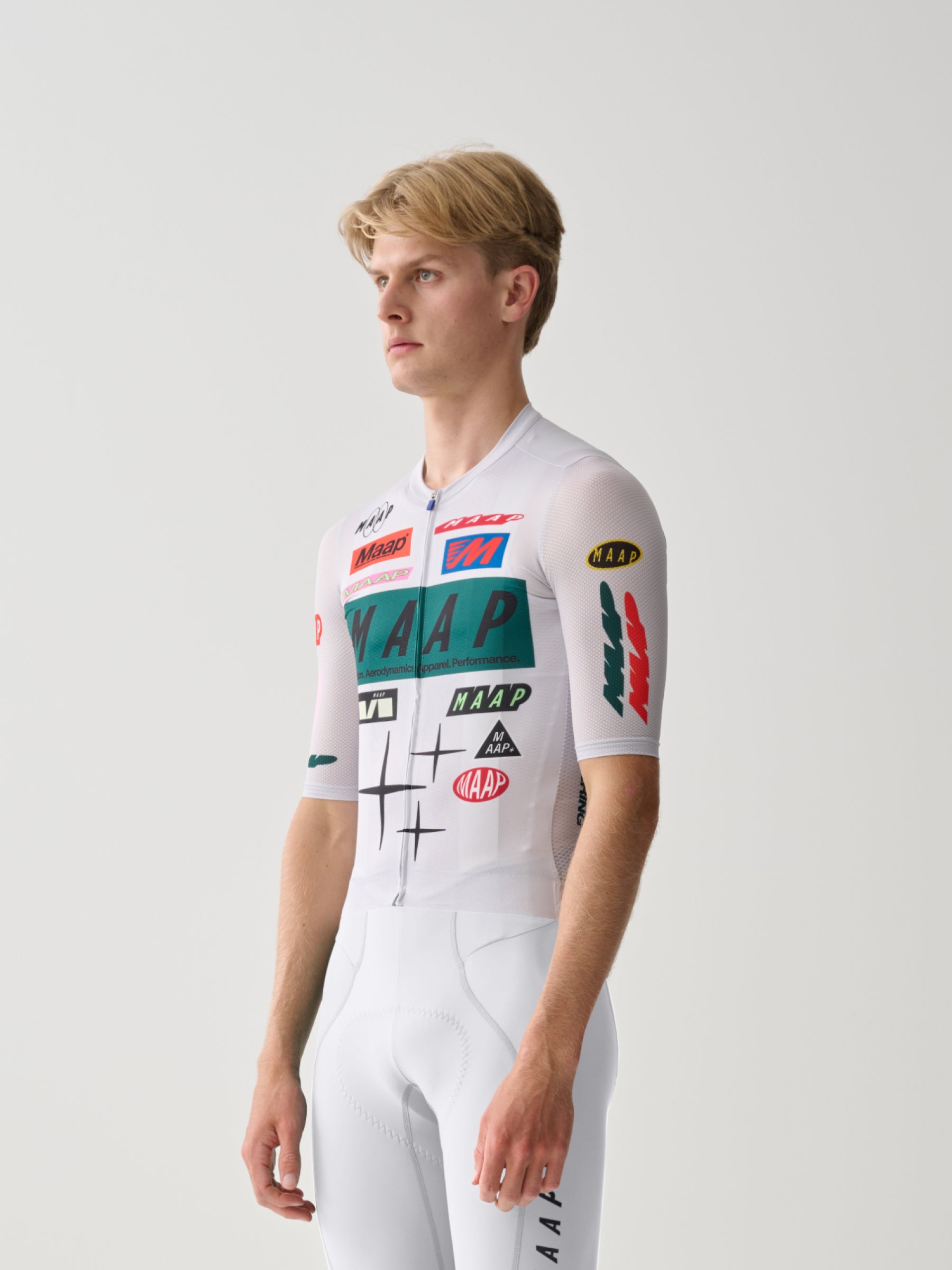A male cyclist showing the front of a Men's MAAP Drome Short Sleeve Jersey in White