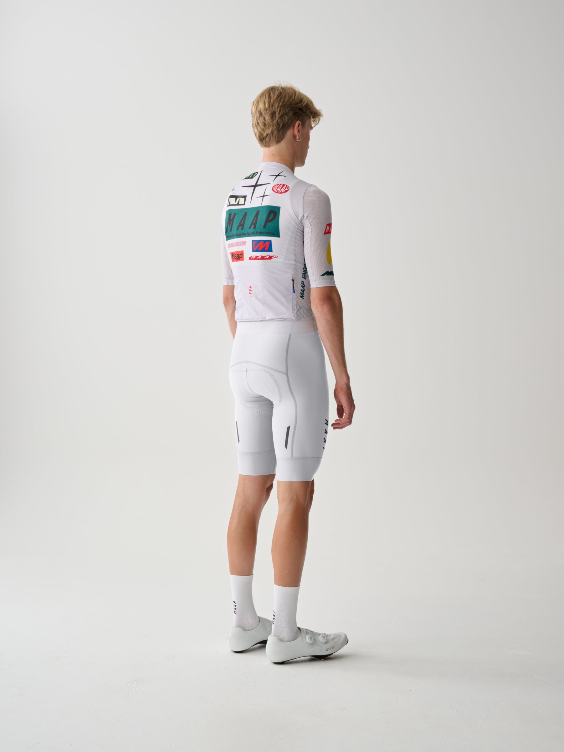A male cyclist showing the back of a Men's MAAP Drome Short Sleeve Jersey in White.