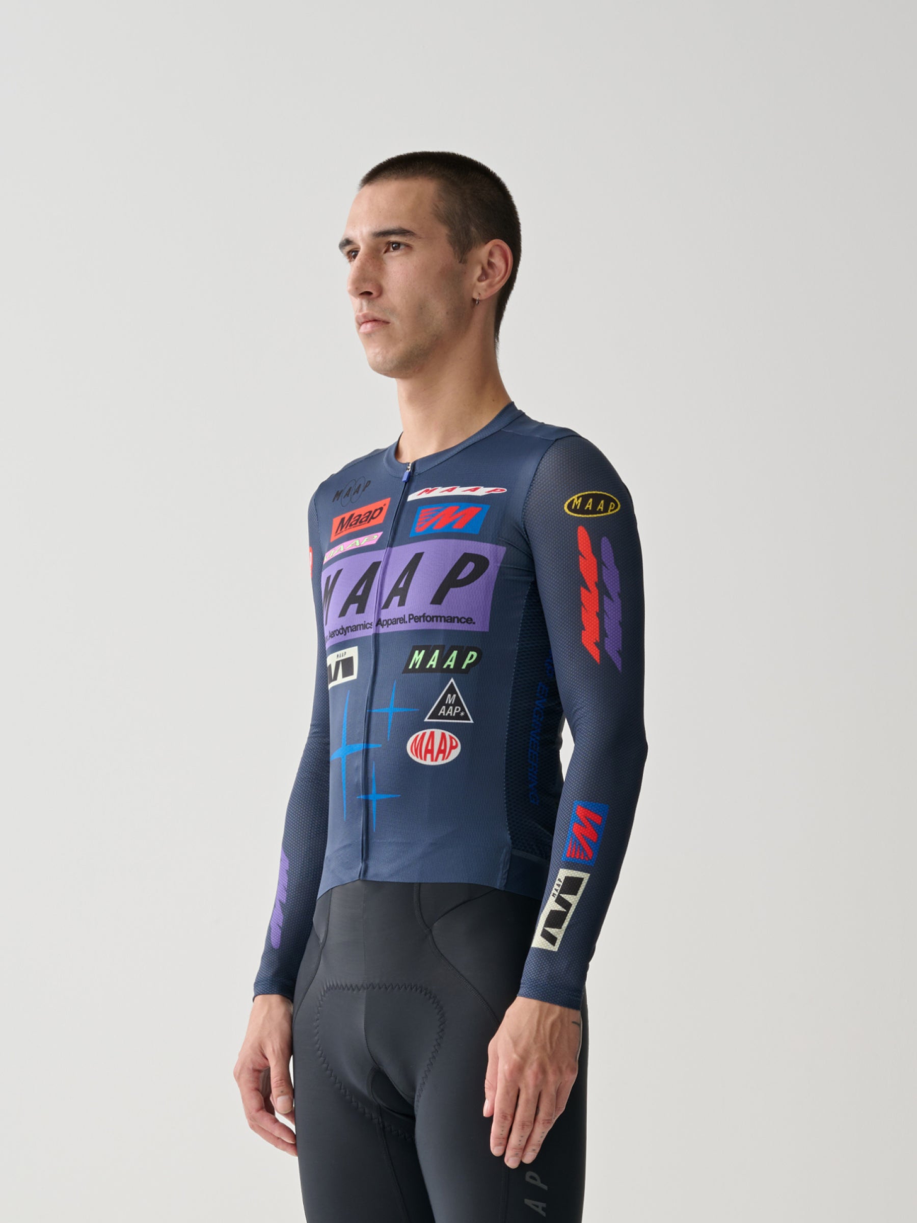 A male cyclist showing the front of a Men's MAAP Drome Long Sleeve Jersey in Midnight Blue