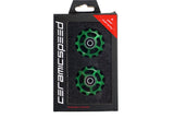 A pair of green CeramicSpeed Pulley Wheels for Shimano 11spd Drivetrains in a box