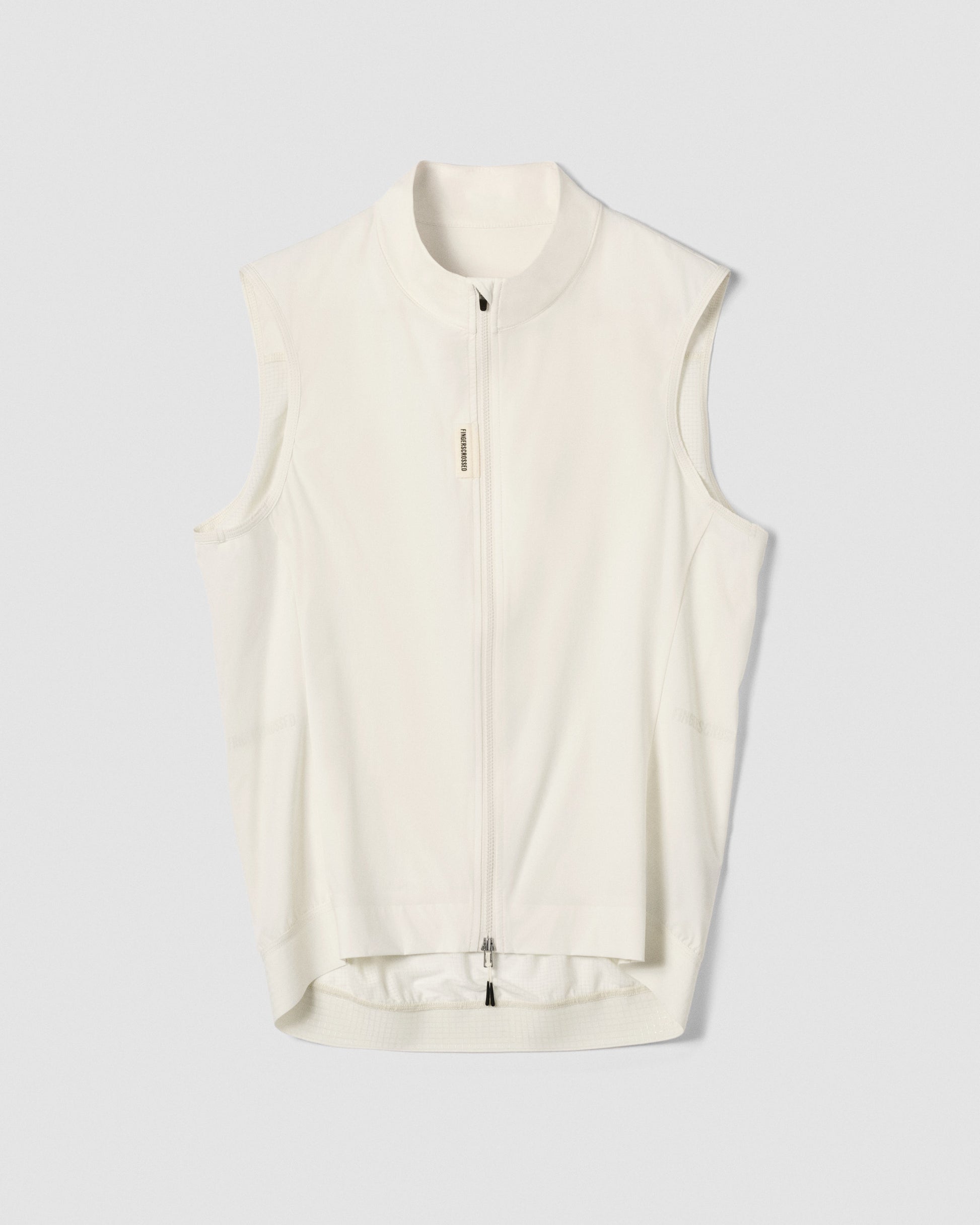 A flat lay image showing the front of a Fingerscrossed #ROAD cycling vest in cream