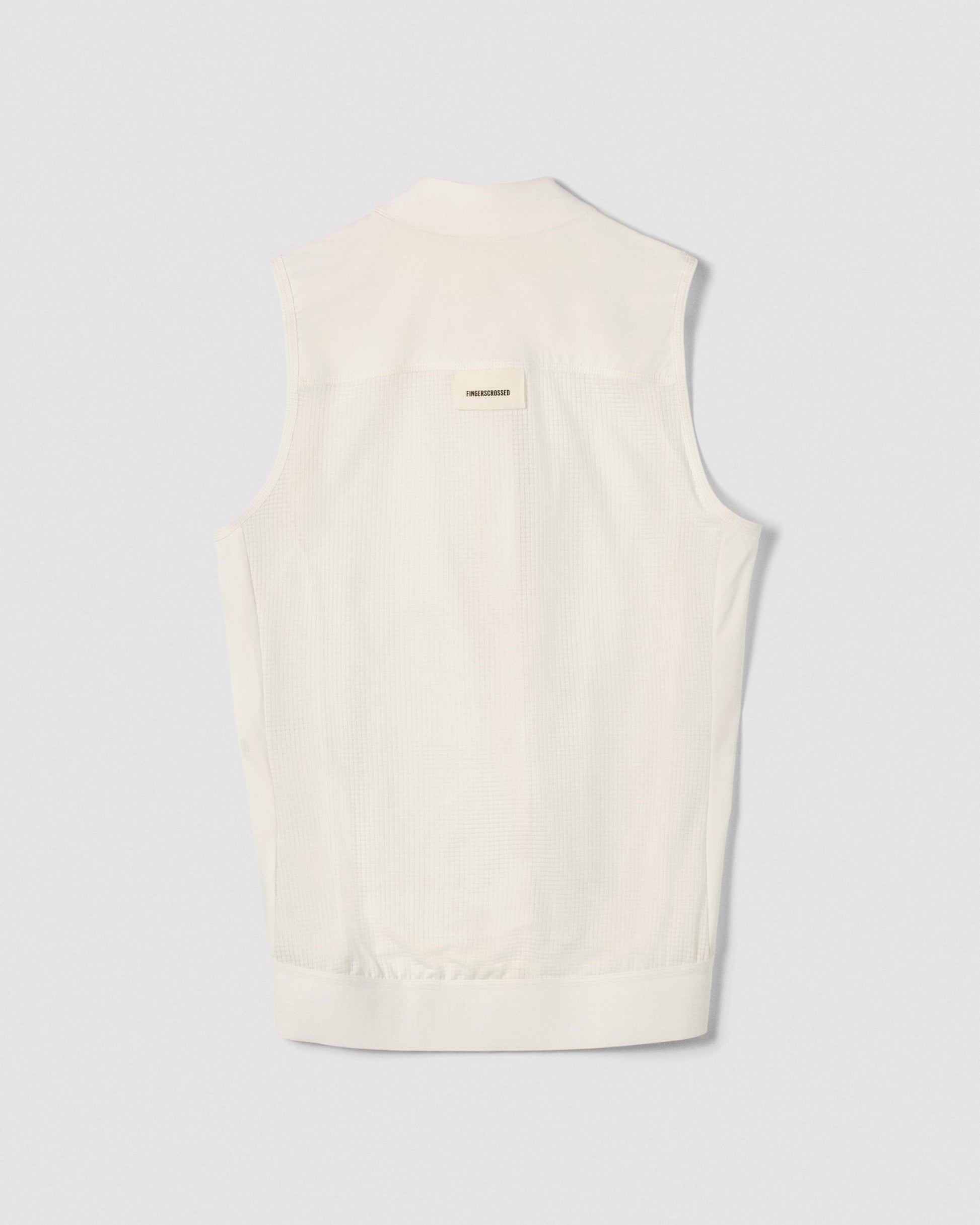 A flat lay image showing the back of a Fingerscrossed #ROAD cycling vest in cream