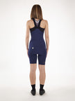 The back of a woman wearing a pair of italian cycling kit manufacturer Santini's Unico Womens Bib Short