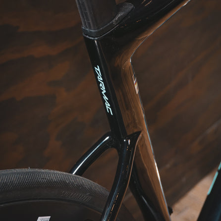 The Tarmac logo on the seat tube of a Specialized SL8 rental bike at Metier Racing & Coffee in Seattle