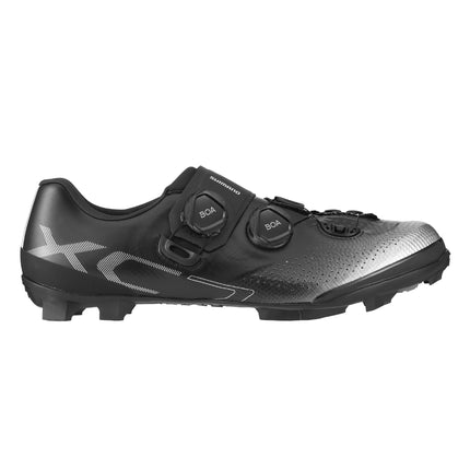 A Shimano SH XC702 Cross Country MTB shoe from the side in black