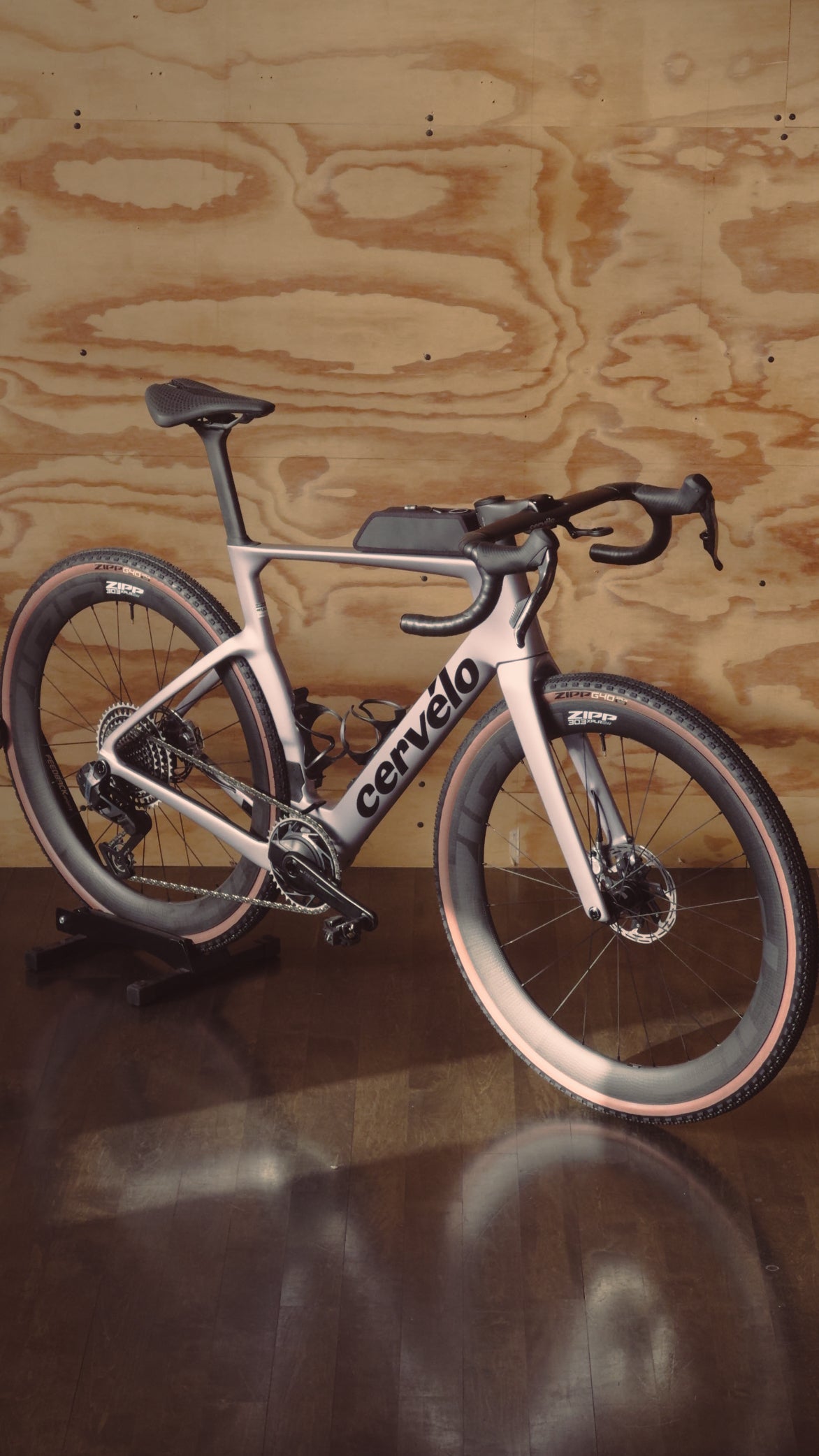 A Cervelo Aspero 5 gravel bike built by Metier on display in a plywood room
