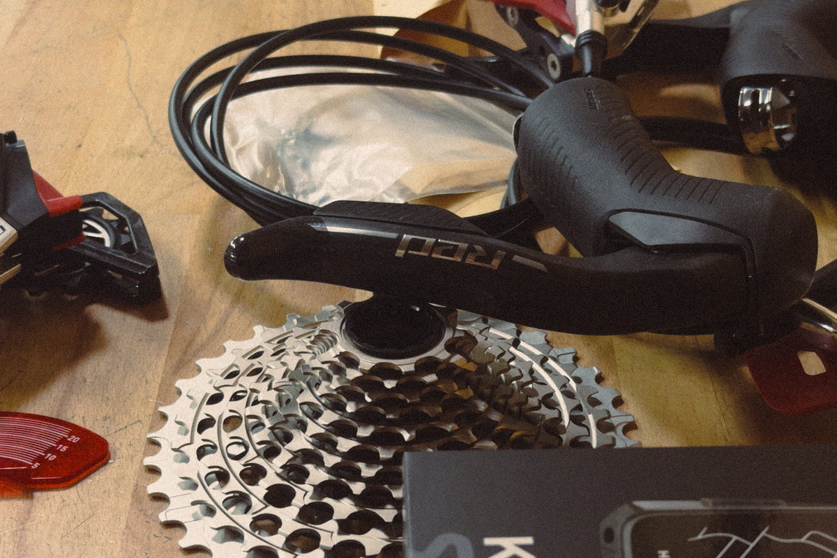 A close up of a SRAM Red E1 group set on a wood table