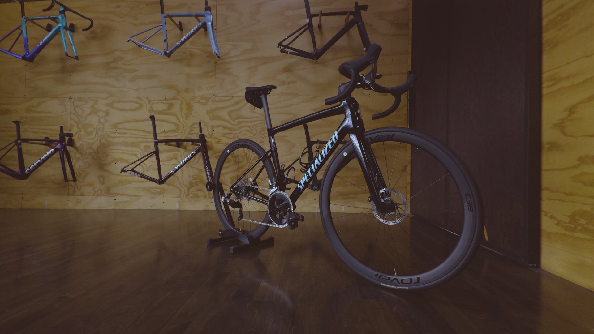 A Specialized Tarmac SL8 Carbon Road Rental Bike displayed in the custom bike room at Metier Seattle